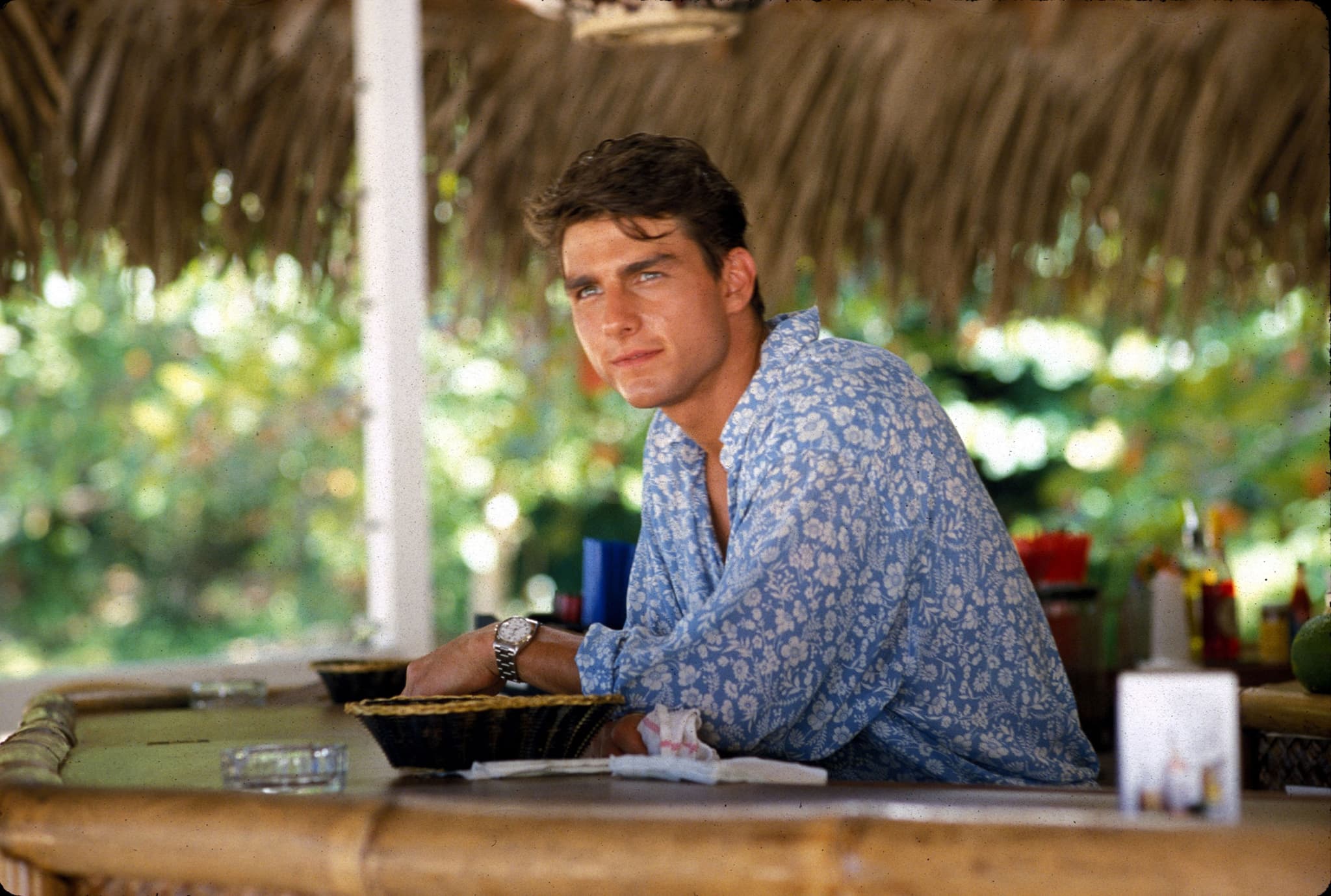 Using his good looks, Tom Cruise plays a hot bartender in Cocktail to make ends meet