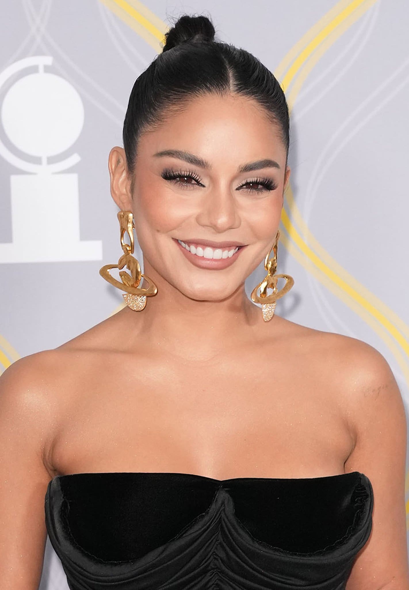 Vanessa Hudgens accessorizes with Schiaparelli planet-shaped earrings