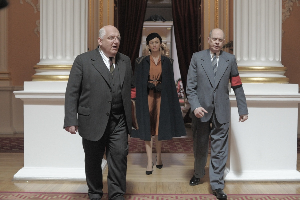 Simon Russell Beale as Lavrenti Beria, Olga Kurylenko as Maria Veniaminovna Yudina, and Steve Buscemi as Nikita Khrushchev in The Death of Stalin