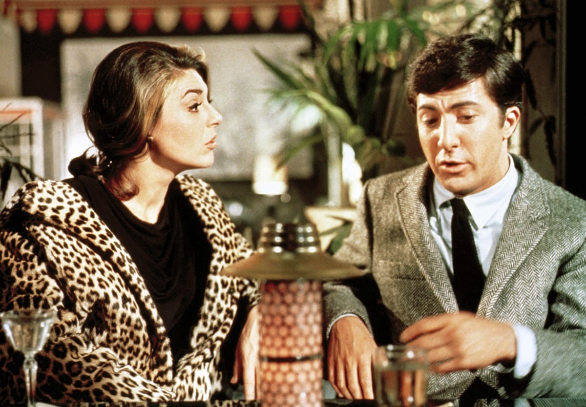 Anne Bancroft wears a leopard jacket as Mrs. Robinson with Dustin Hoffman as Benjamin Braddock in the 1967 American romantic comedy-drama film The Graduate