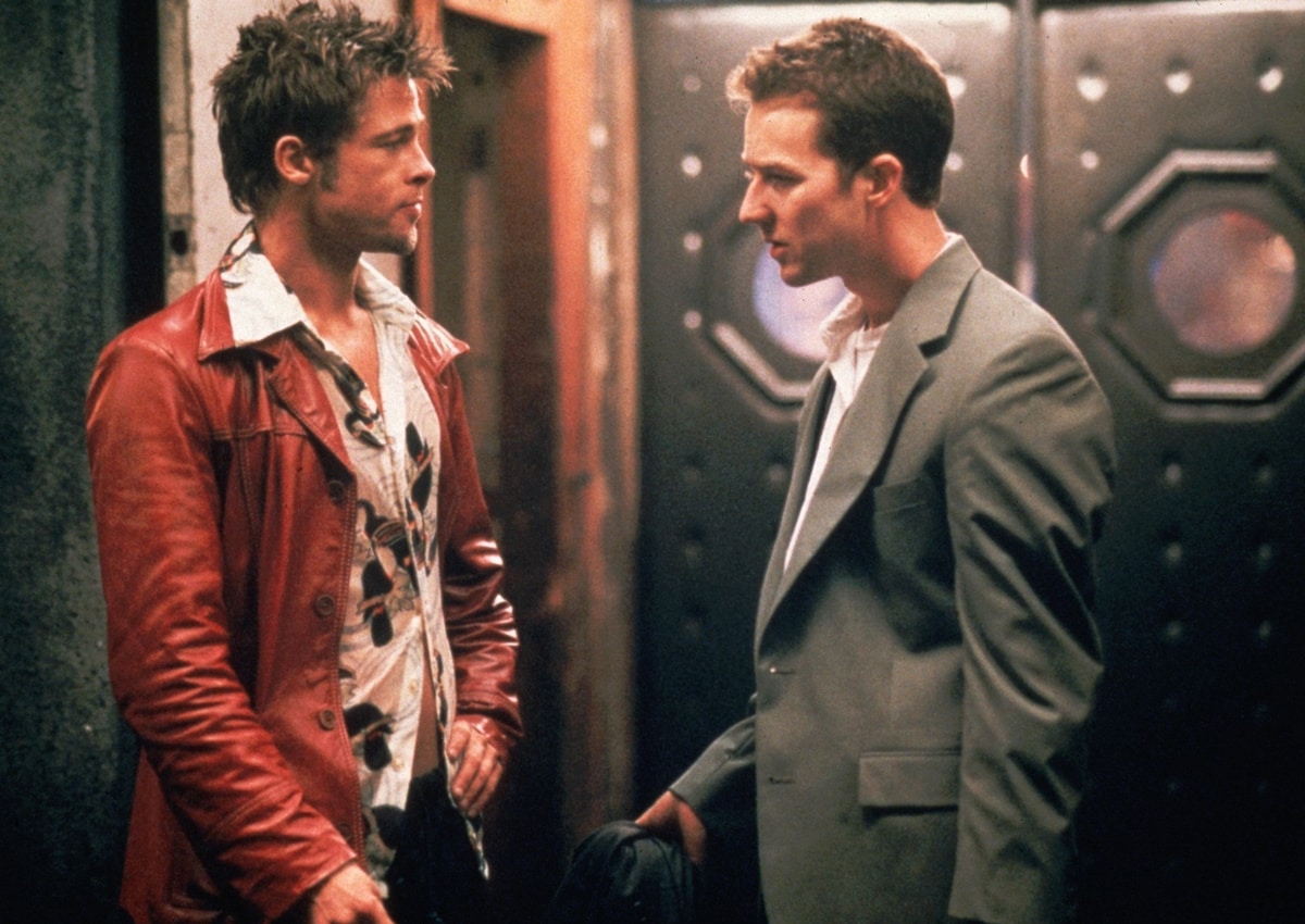 Brad Pitt wears a red leather biker jacket as Tyler Durden with Edward Norton as the Narrator in the 1999 American film Fight Club