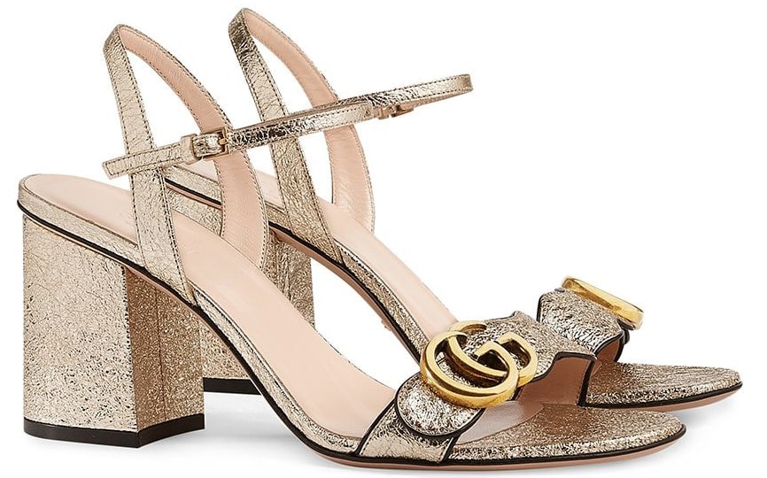 These crinkled metallic leather sandals from Gucci boast the fashion house's archival double GG logo on the toe strap