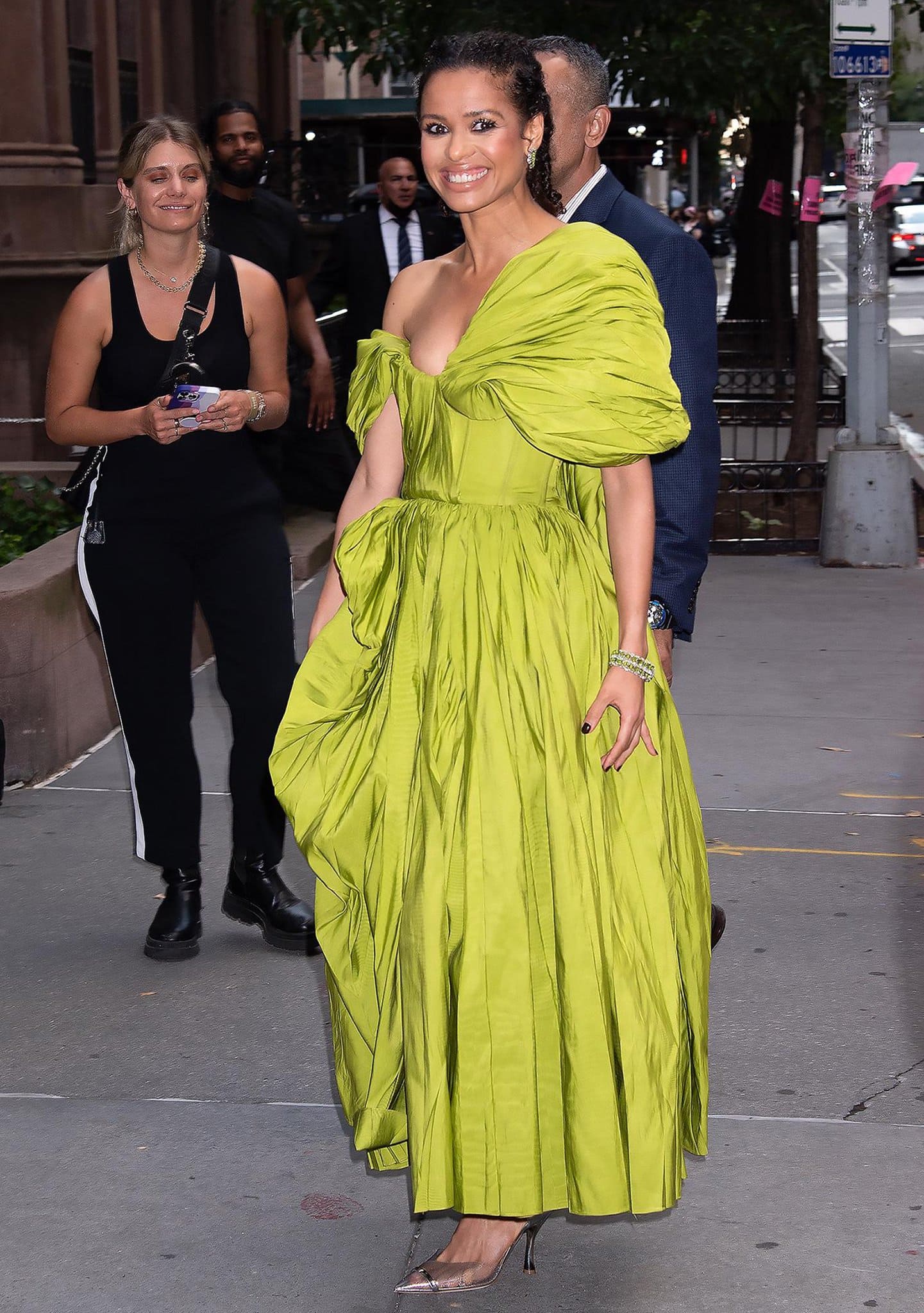 Gugu Mbatha-Raw is hard to ignore in a crinkled lime green Alexander McQueen gown