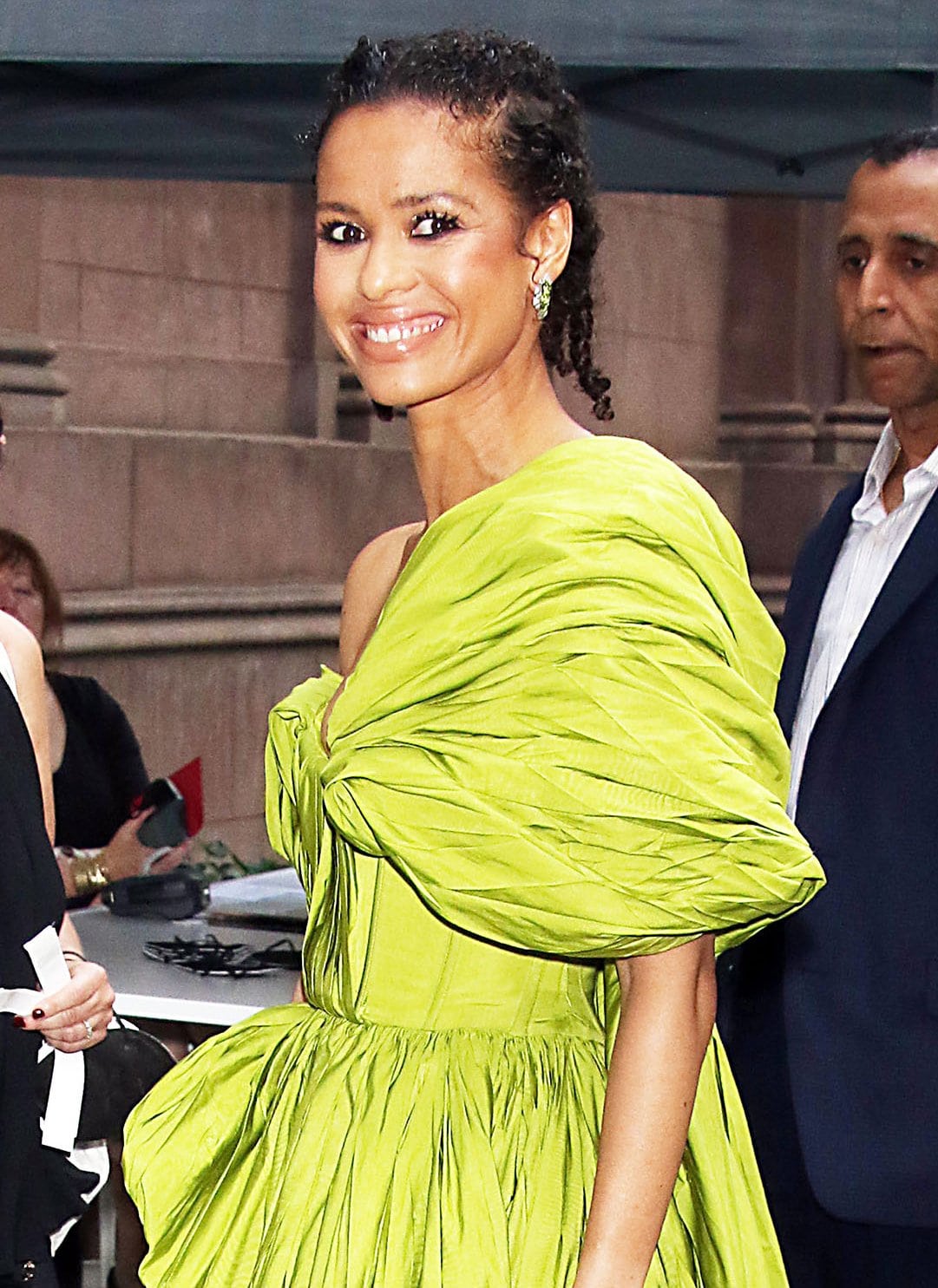 Gugu Mbatha-Raw styles her curly tresses in pigtail braids and wears mascara and black liner to accentuate her eyes