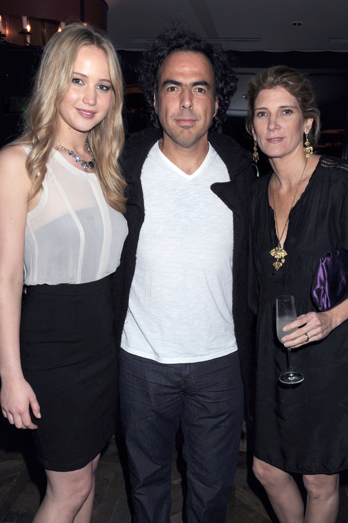 Jennifer Lawrence with Alejandro González Iñárritu and his wife María Eladia Hagerman attend a Grey Goose party at Soho House to honor the casts of “Biutiful” and “Winter’s Bone”