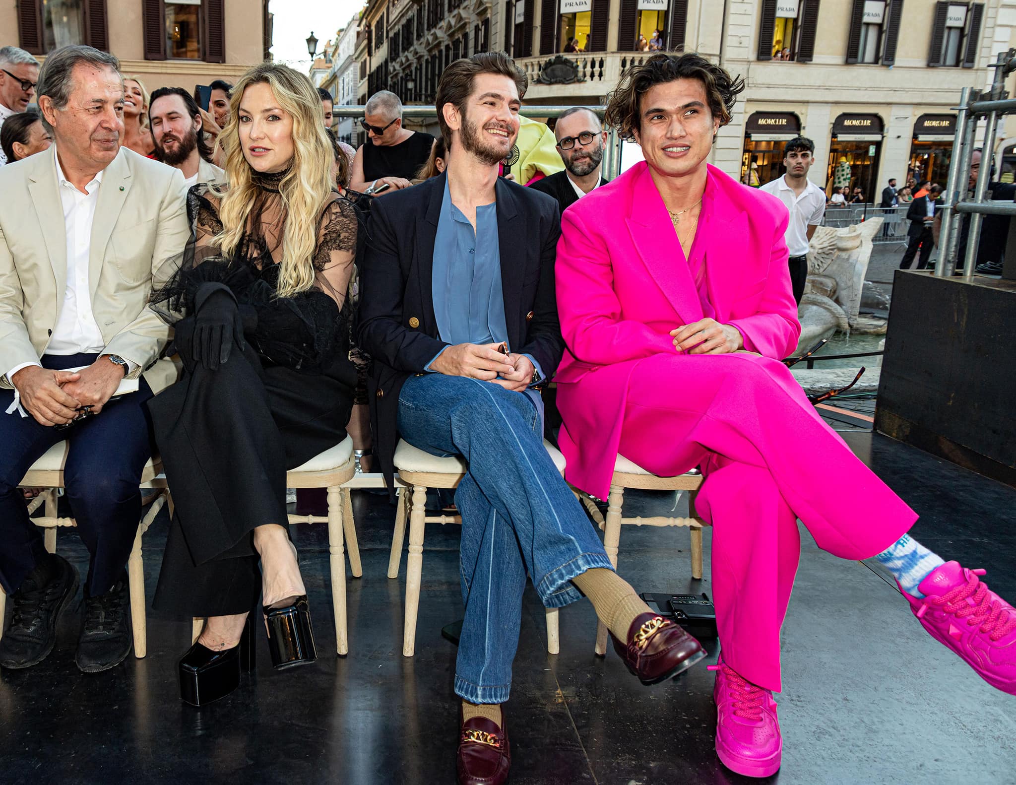 Kate Hudson sits front row next to Andrew Garfield and Charles Melton