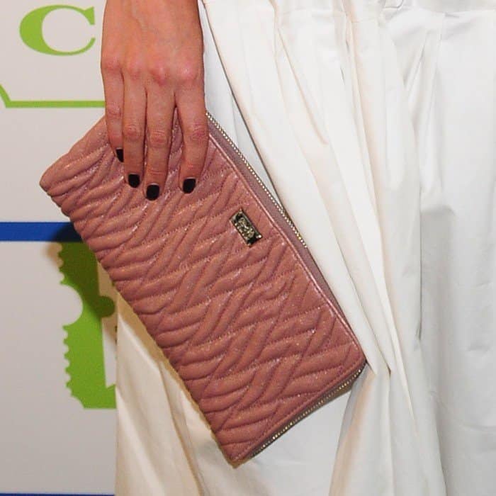 Katie Holmes totes a Coach Madison gathered leather zip clutch