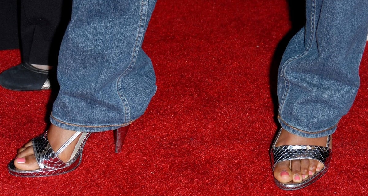 Kelly Rowland steps out in open-toe metallic sandals, showing off her feet, visible corns, and fresh pedicure