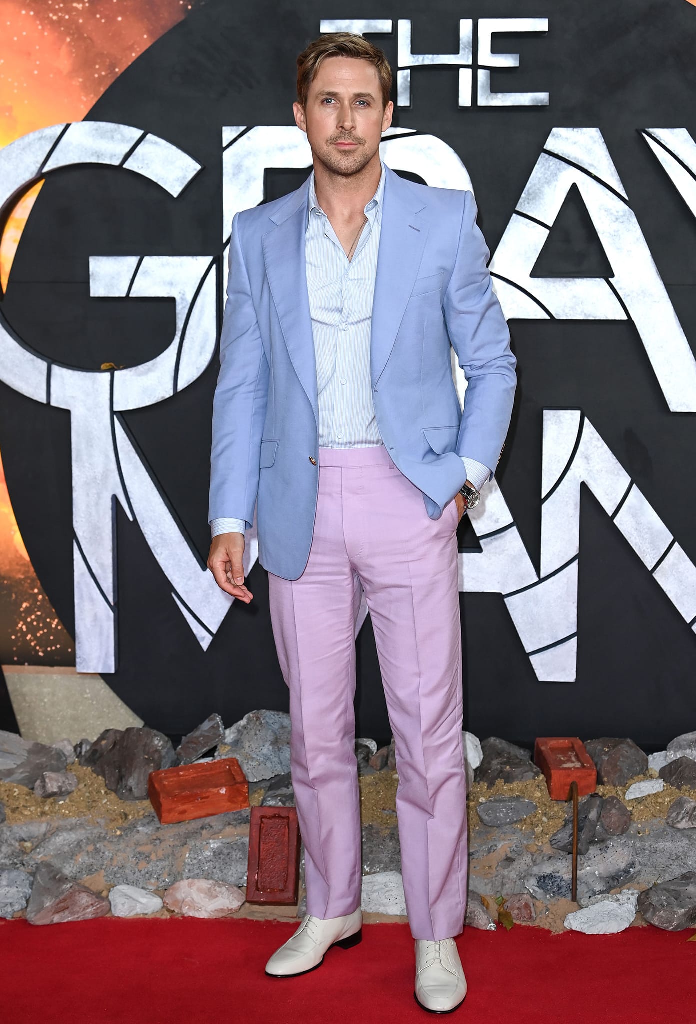 Ryan Gosling is stylish in a pastel Gucci suit, featuring a lilac jacket and a pair of pink trousers