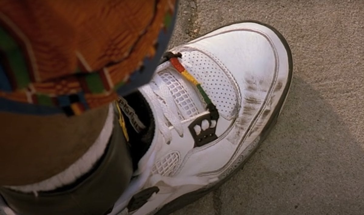 Giancarlo Esposito as Buggin' Out gets his Air Jordan 4 “White/Cement” sneakers tarnished after a Boston Celtics fan steps on them in the 1989 American comedy-drama film Do the Right Thing