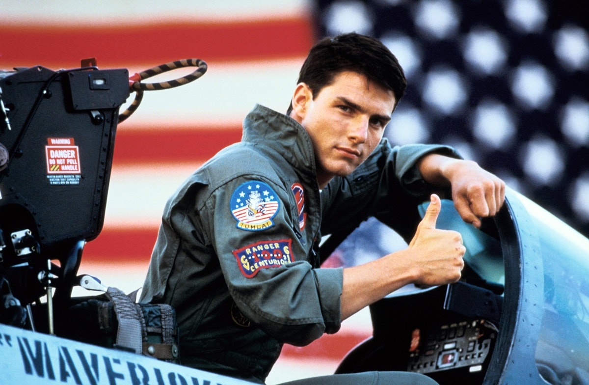 Tom Cruise wears a leather G-1 jacket as as LT Pete "Maverick" Mitchell in the 1986 American action drama film Top Gun