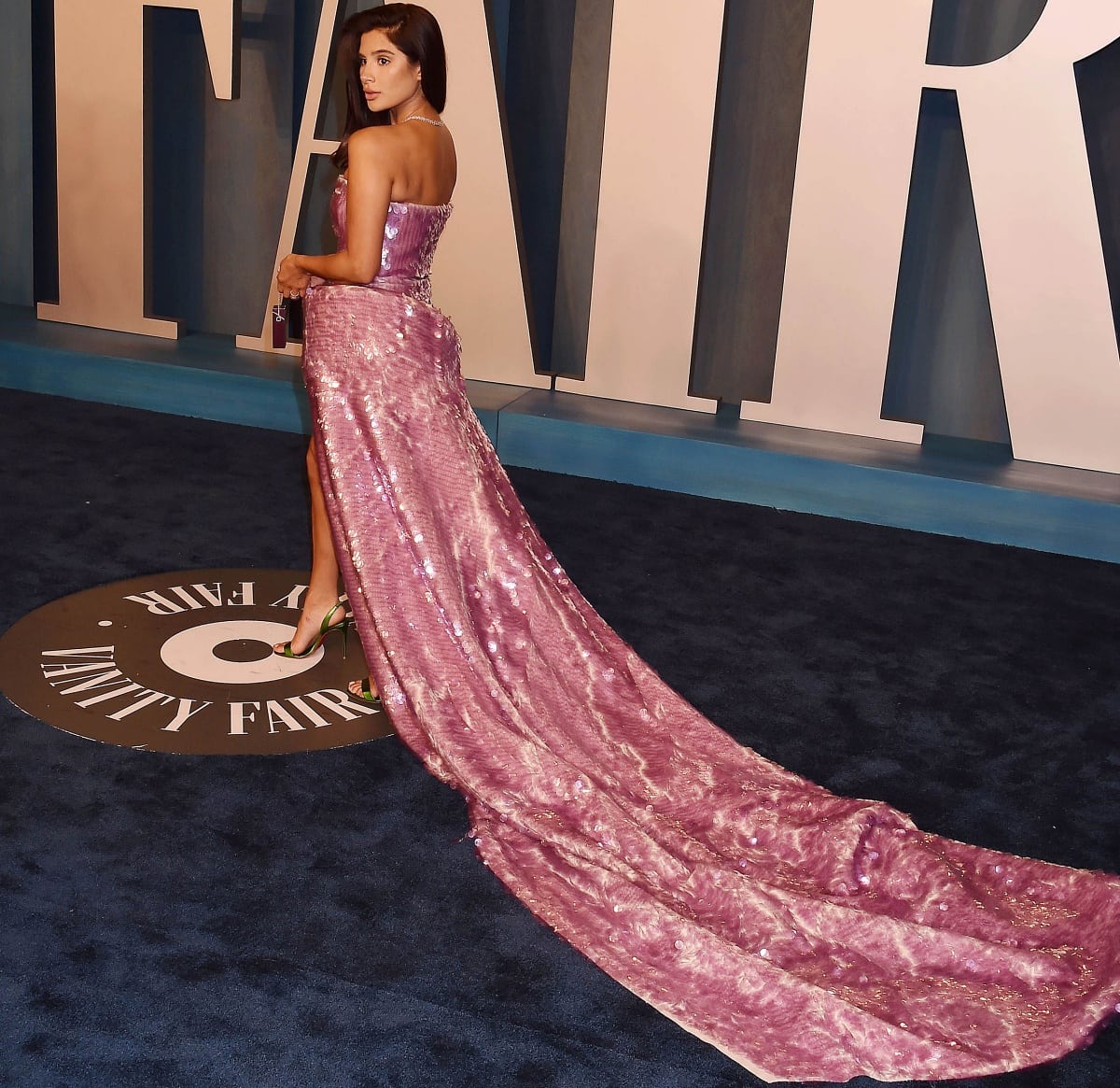 Diane Guerrero wearing an Off-White dress with a long train and Christian Louboutin slingback heels