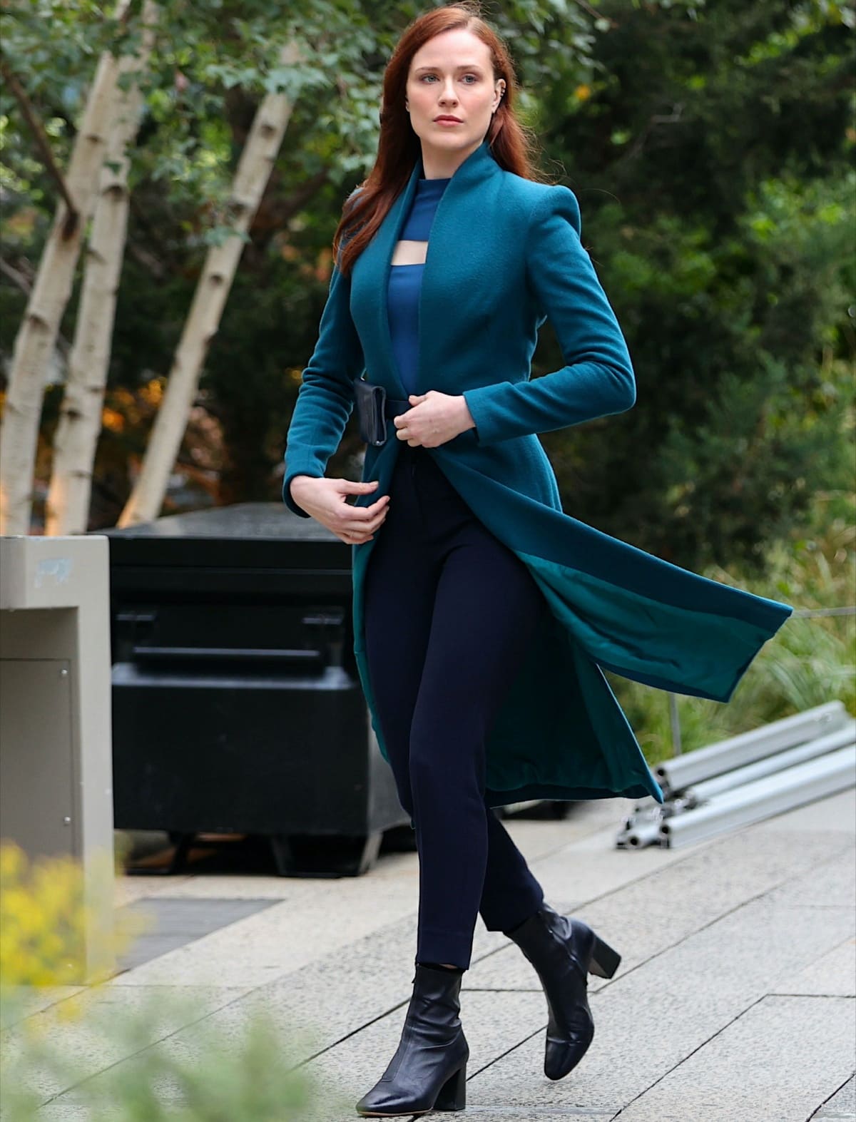 Evan Rachel Wood wearing a structured green coat and black leather boots while filming Westworld in Manhattan