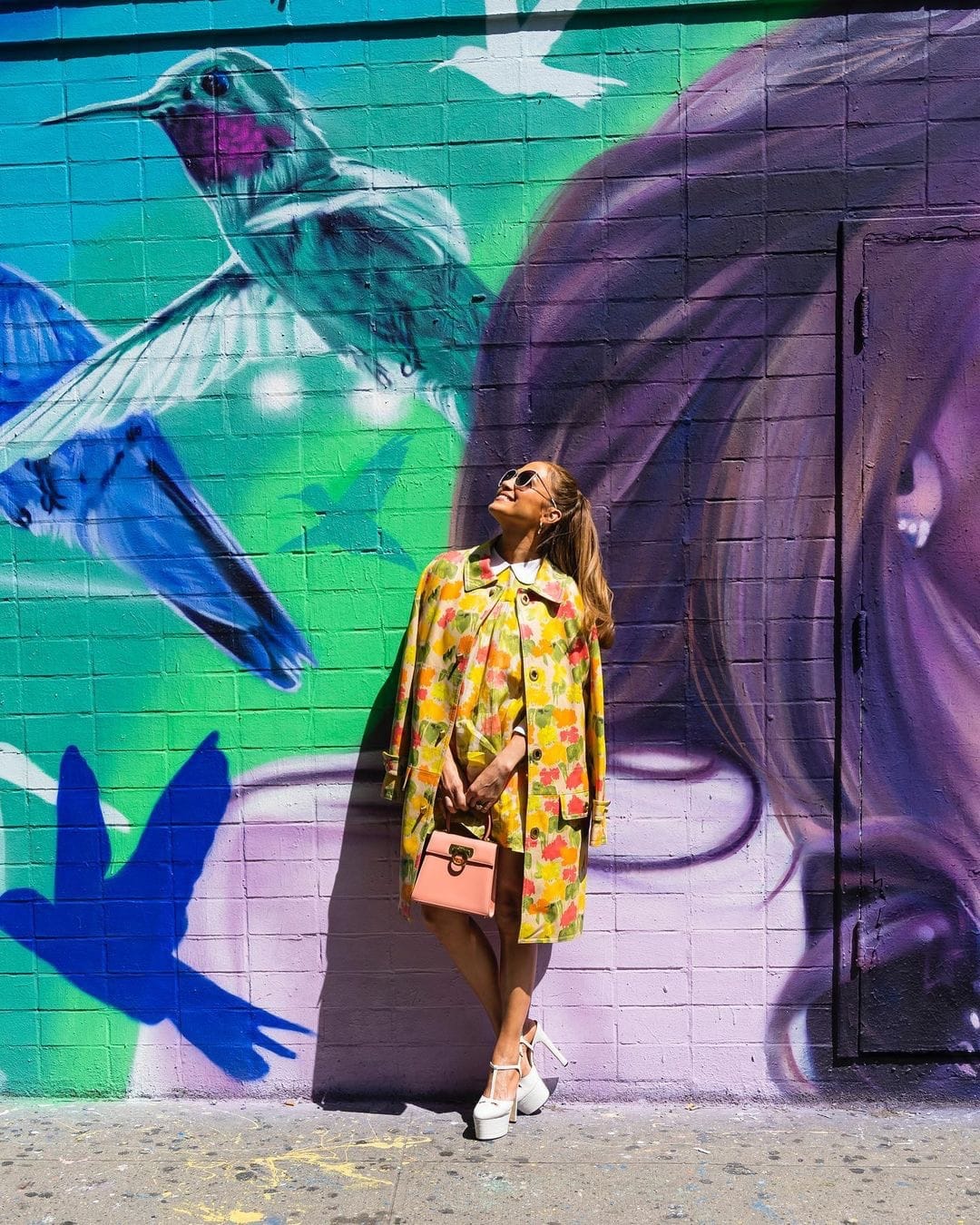 Jennifer Lopez in front of her mural on Ludlow Street