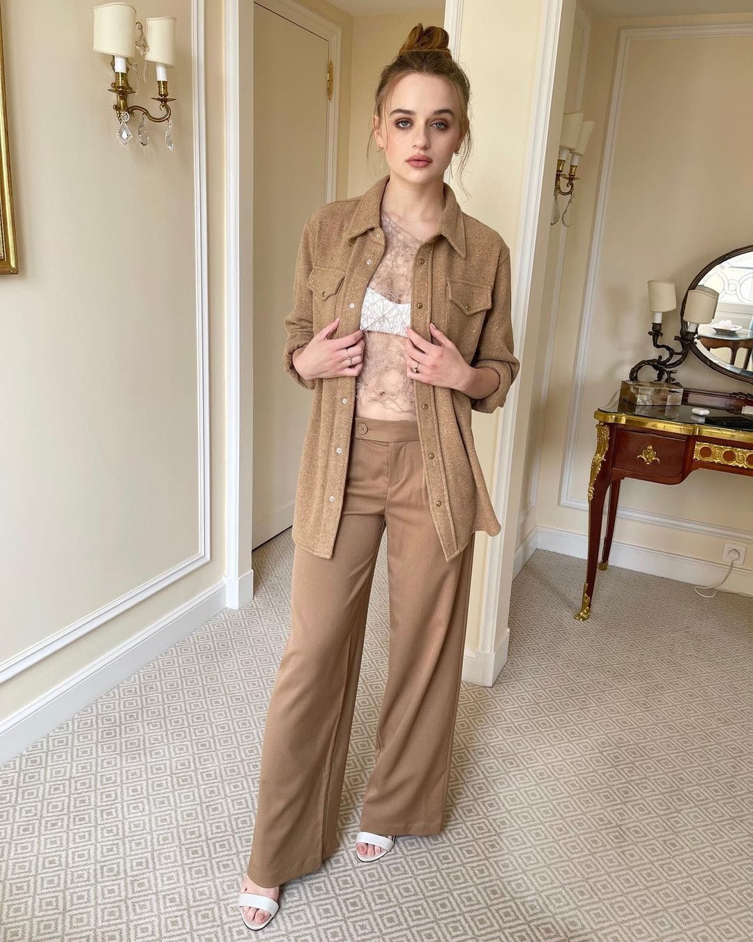 Joey King switching it up from her all-black aesthetic to a soft caramel-toned outfit for a Paris press junket