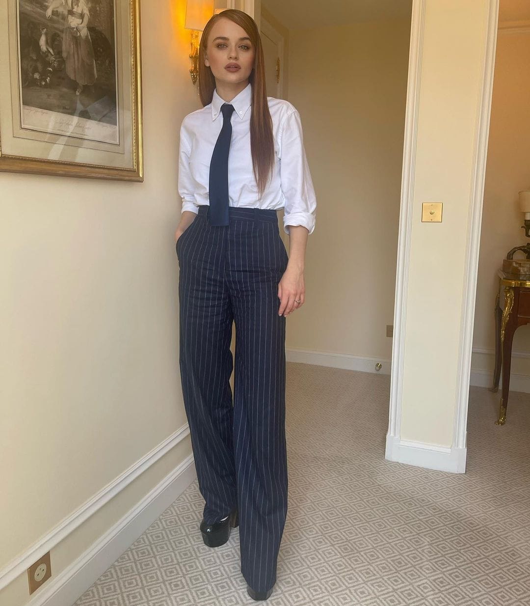 Joey King means business in a Kenzo suit with Thom Browne platform shoes for a press junket in Paris