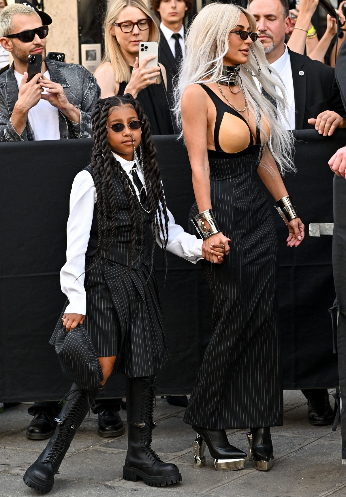 North West and Kim Kardashian making a striking entrance at the Jean Paul Gaultier x Olivier Rousteing show