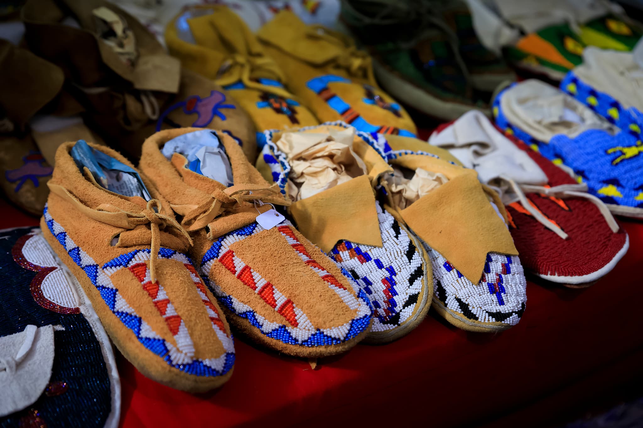 Handcrafted moccasins adorned with intricate beadwork showcase the artistry and cultural heritage of Indigenous craftsmanship