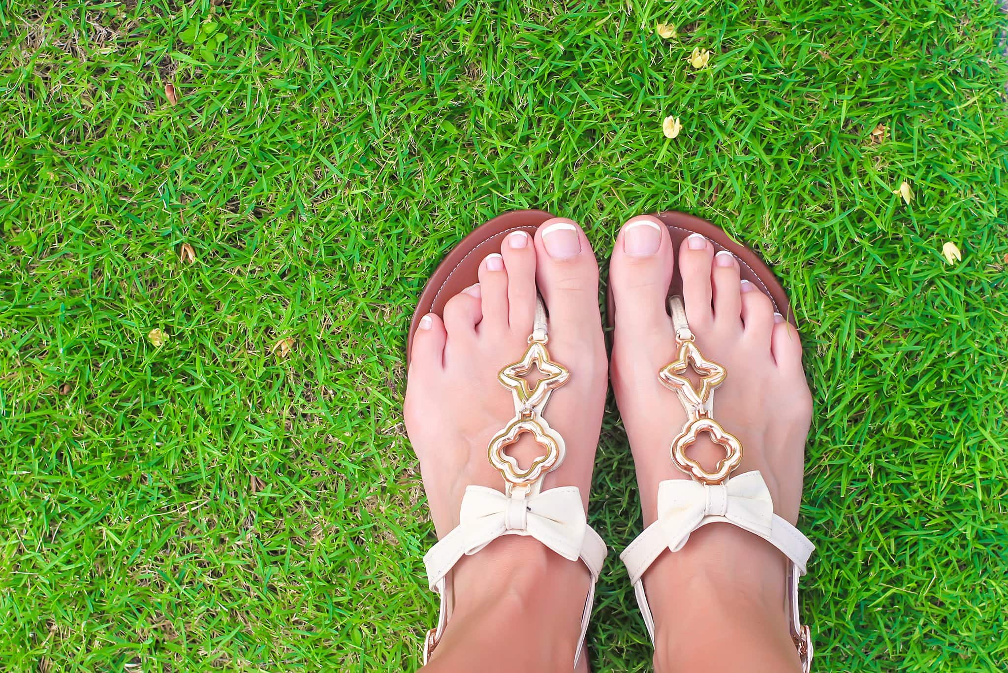 Thong sandals are defined by the strip of leather between the toes connected to the strap across the top or around the sides of the sandals