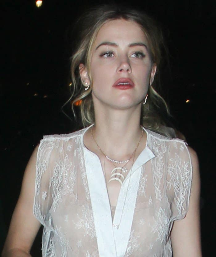 Amber Heard in a sheer lace dress arrives back at the 5-star Claridge’s hotel in London