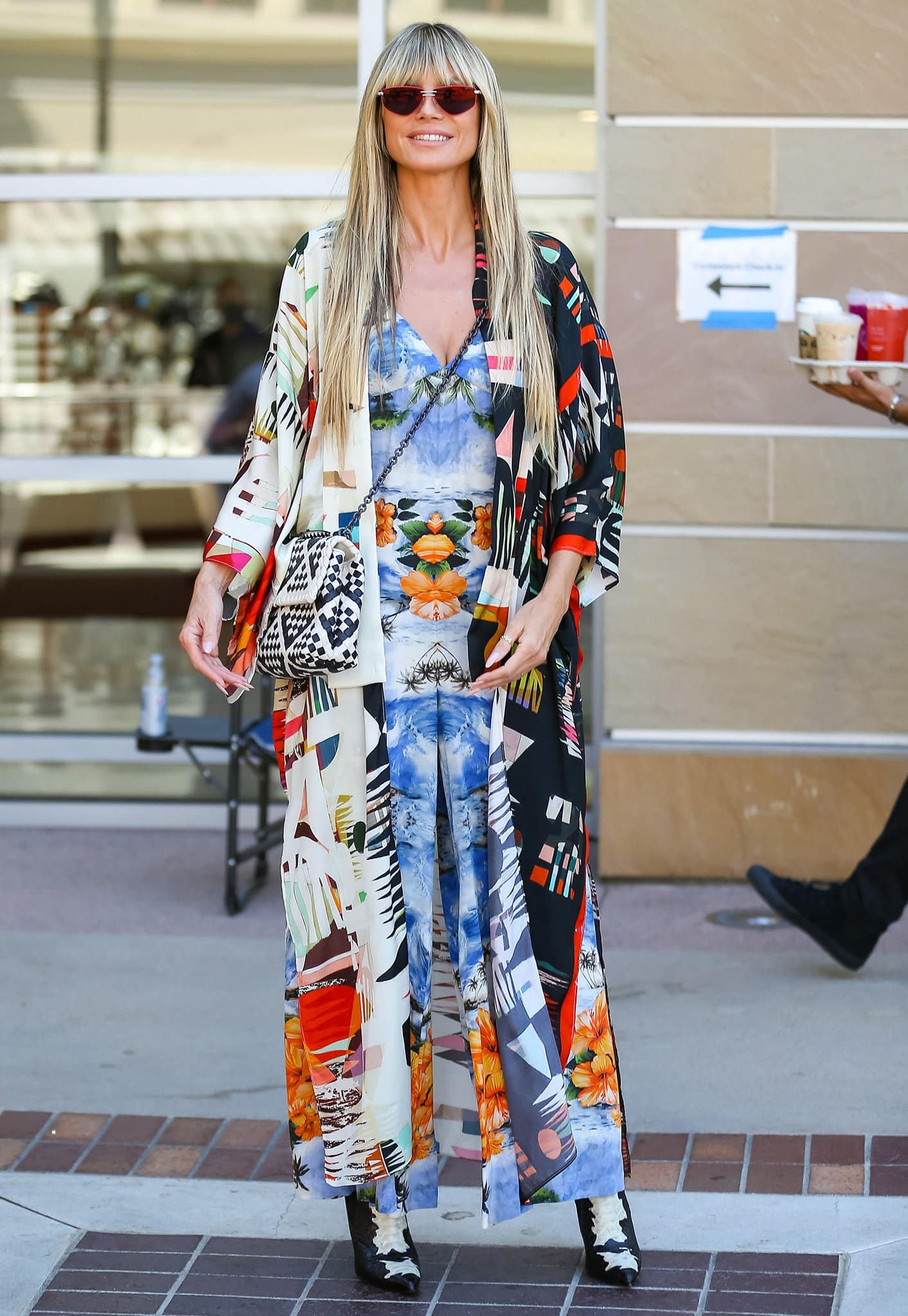 Heidi Klum makes a bold, colorful appearance outside the AGT set in a Stella McCartney Hawaiian-print jumpsuit