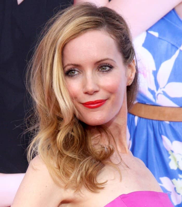Actress Leslie Mann shows off her earrings by Dana Rebecca Designs at the Los Angeles premiere of 'The Other Woman'