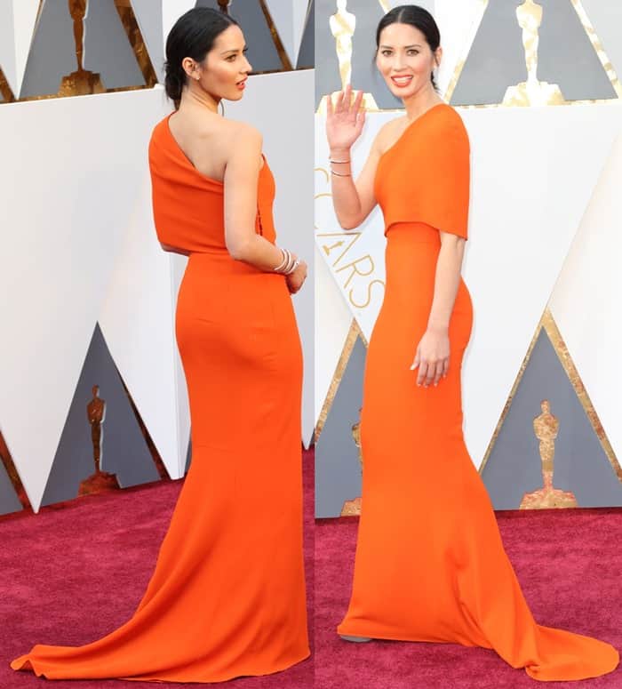 Olivia Munn in orange long train Stella McCartney gown at the 2016 Academy Awards