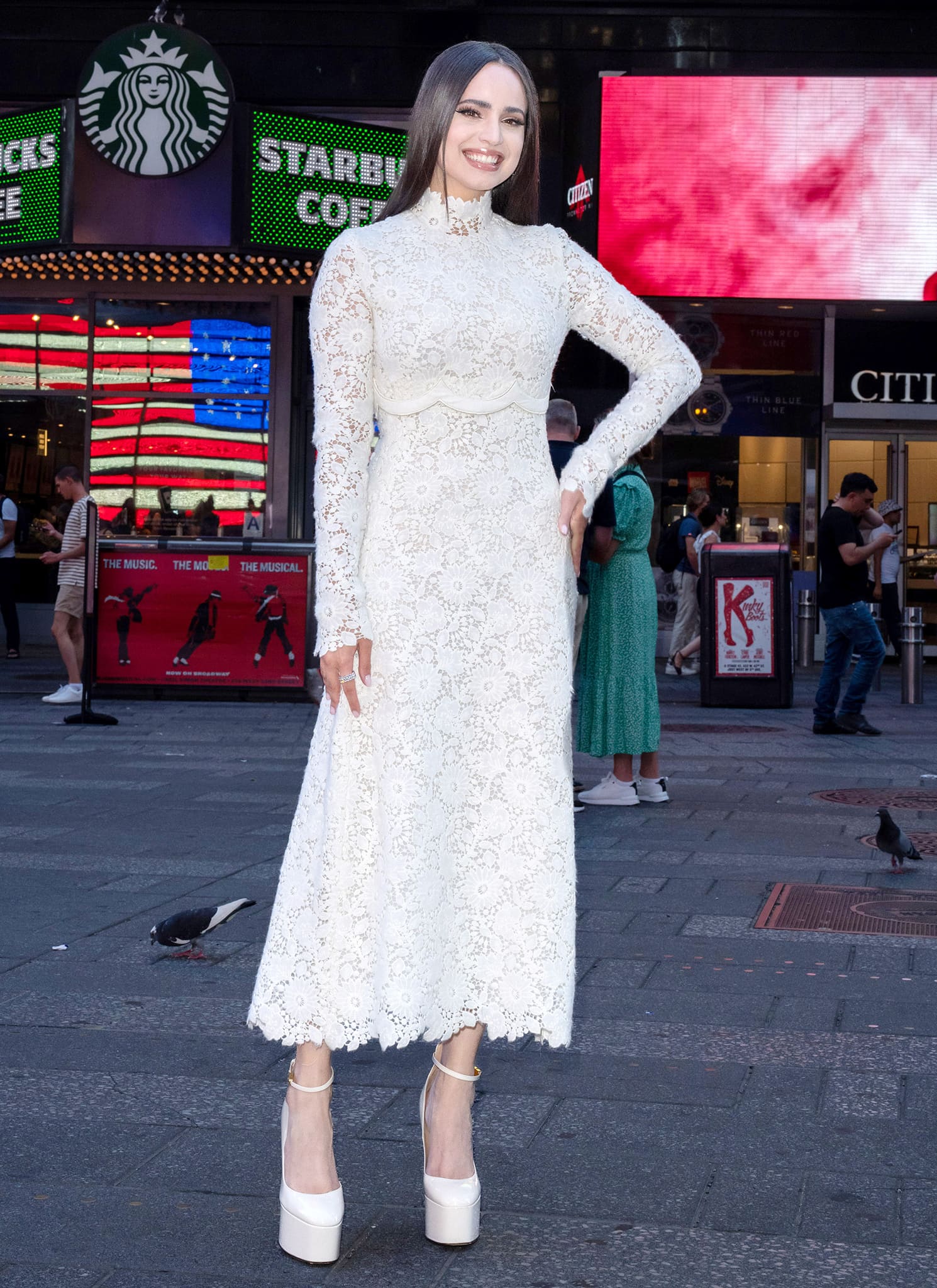 Sofia Carson looks elegant in a white lace Giambattista Valli dress for her debut appearance on The Tonight Show Starring Jimmy Fallon on August 8, 2022