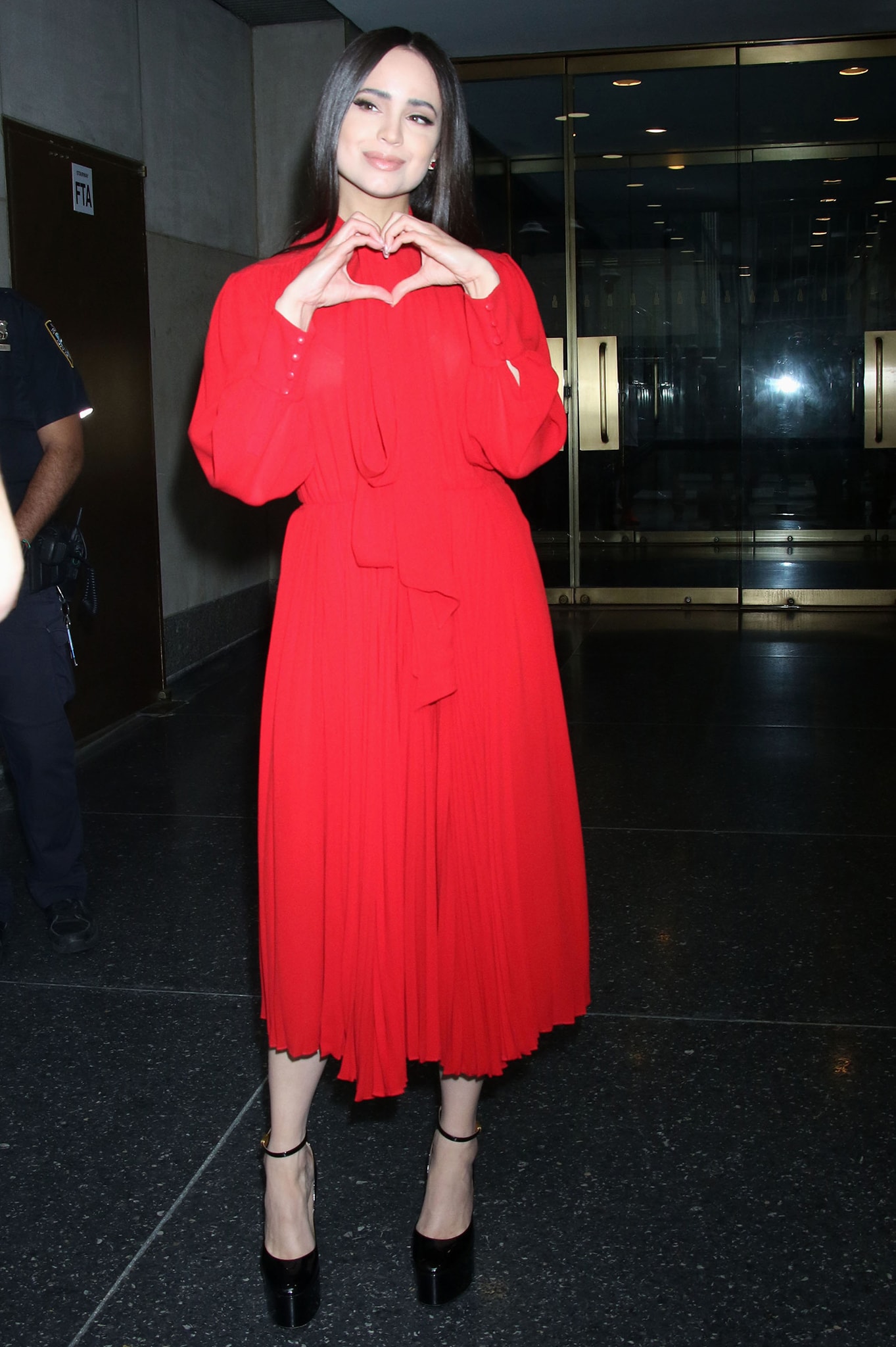 Sofia Carson visits the Today Show in a red Valentino dress on July 25, 2022