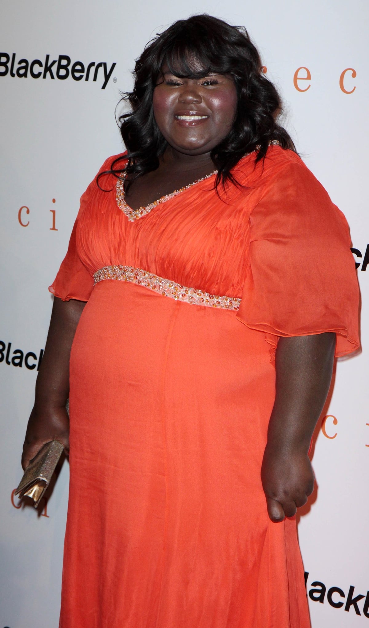 Actress Gabourey 'Gabby' Sidibe in an orange dress at the "Precious" Pre Gala Screening Cocktail Reception