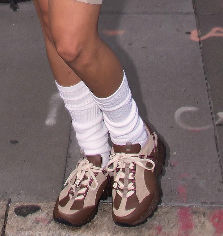 Bella Hadid keeps the look coordinated with Nike x Jacquemus sneakers