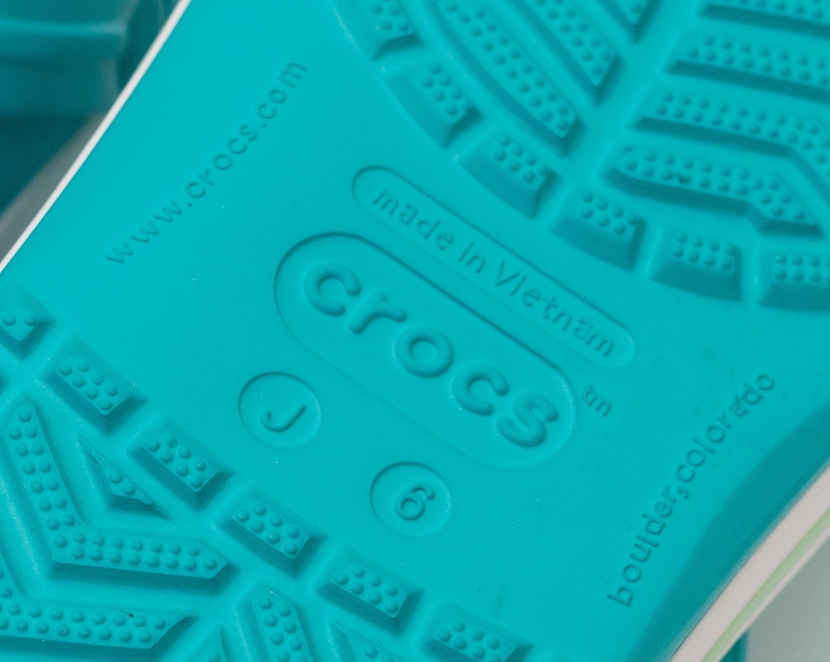 The sole of a real pair of Crocs will show you where the shoe was manufactured, sizing, website information, and that Crocs was founded in Boulder, Colorado