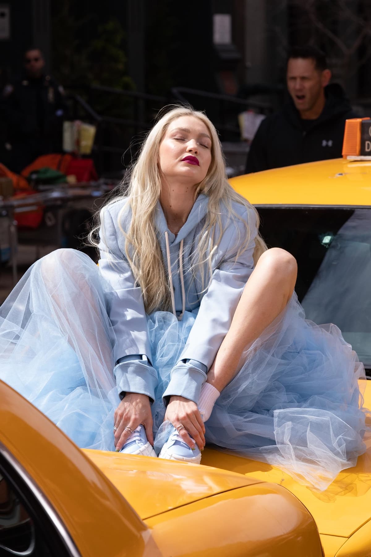 Gigi Hadid, in a blue tulle skirt and Prada sneakers, is seen filming for Maybelline in Tribeca