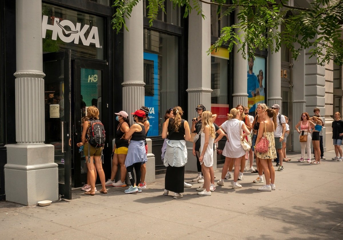 Shoppers line up to enter the Hoka sneaker store in the Flatiron neighborhood of New York City