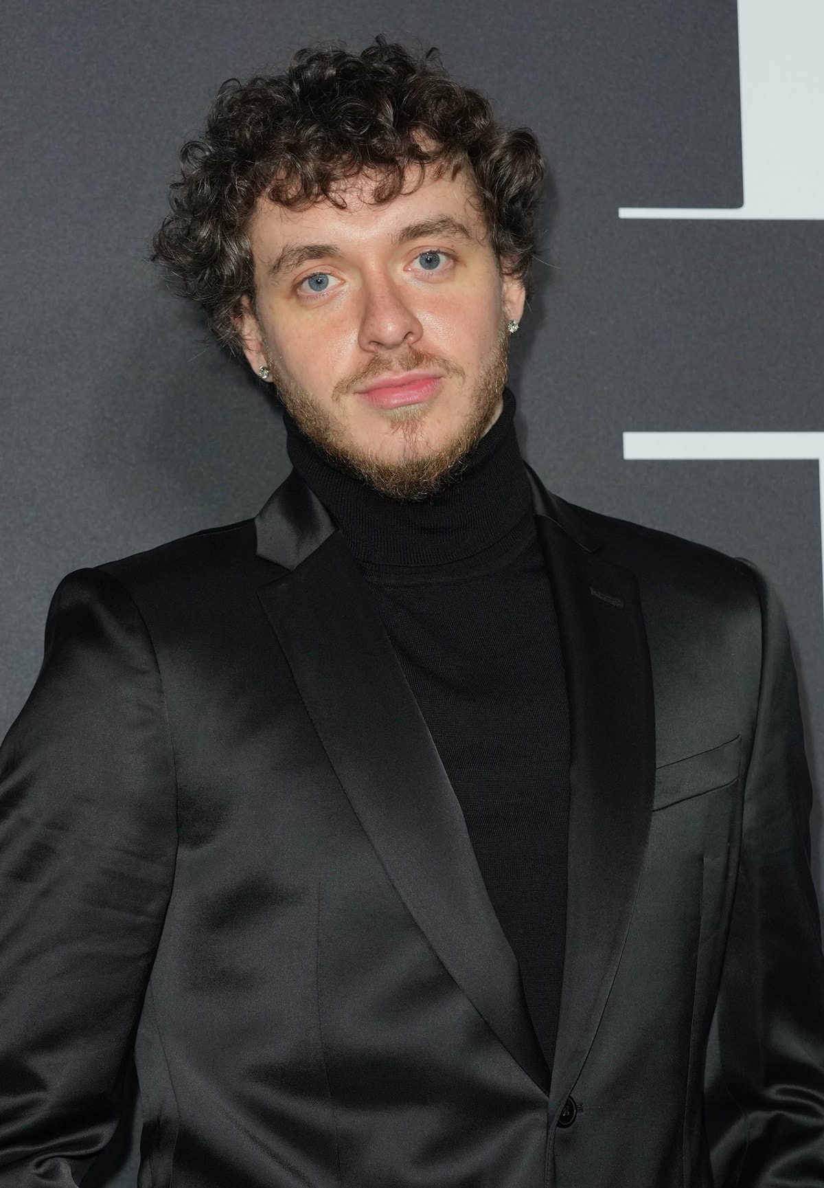 Jack Harlow in a black suit at Harper’s BAZAAR Global ICONS Portfolio and Bloomingdale’s 150th Anniversary at Bloomingdale’s