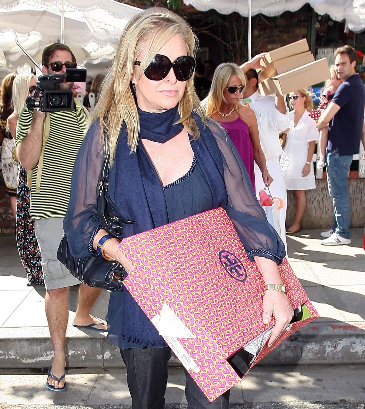 Kathy Hilton holds a Tory Burch box as she leaves Ivy Restaurant in Los Angeles