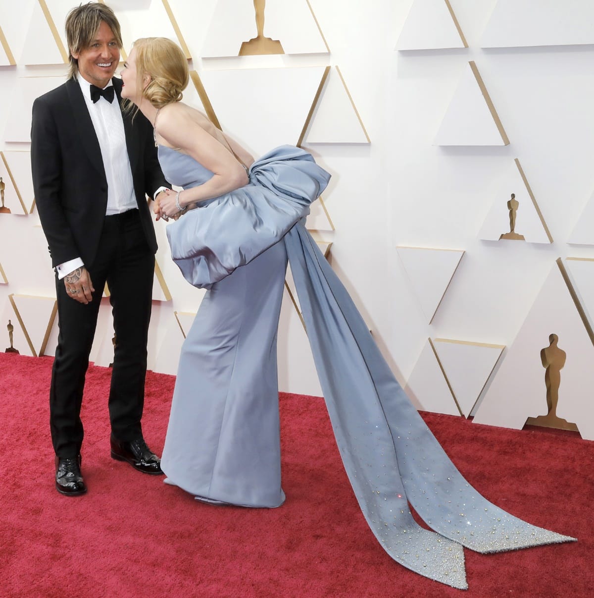 Red Carpet Giants: Nicole Kidman looms over Keith Urban, embracing her height at the 94th Annual Academy Awards