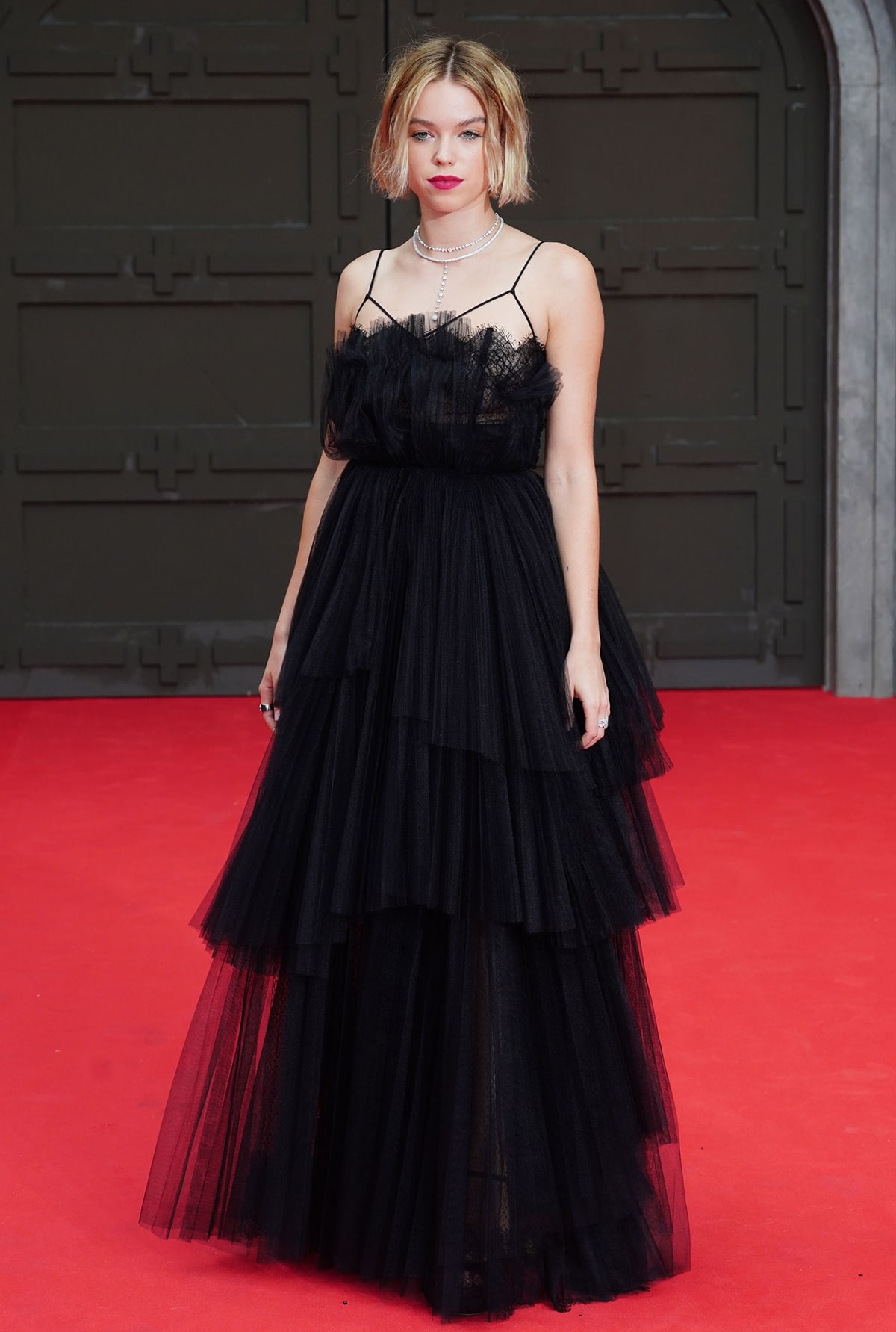 Milly Alcock in a black Saint Laurent Fall 2022 gown at the "House Of The Dragon" Sky Group Premiere
