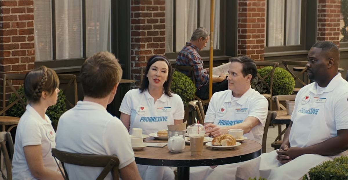 Paul Mabon as Alan, Regan Burns as Rodney, and Stephanie Courtney as Flo in a Progressive insurance commercial