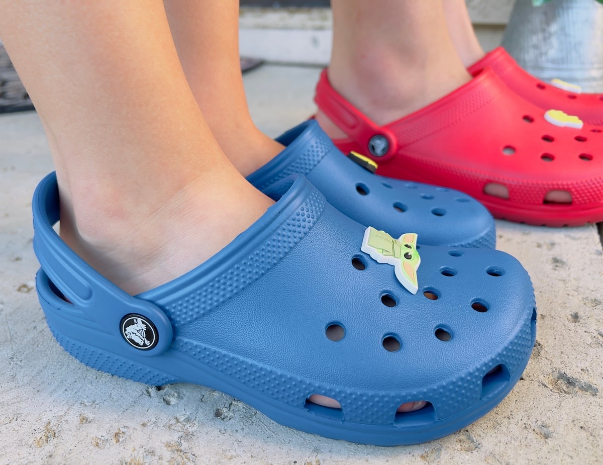 Red and blue Crocs shoes with the iconic Duke crocodile logo