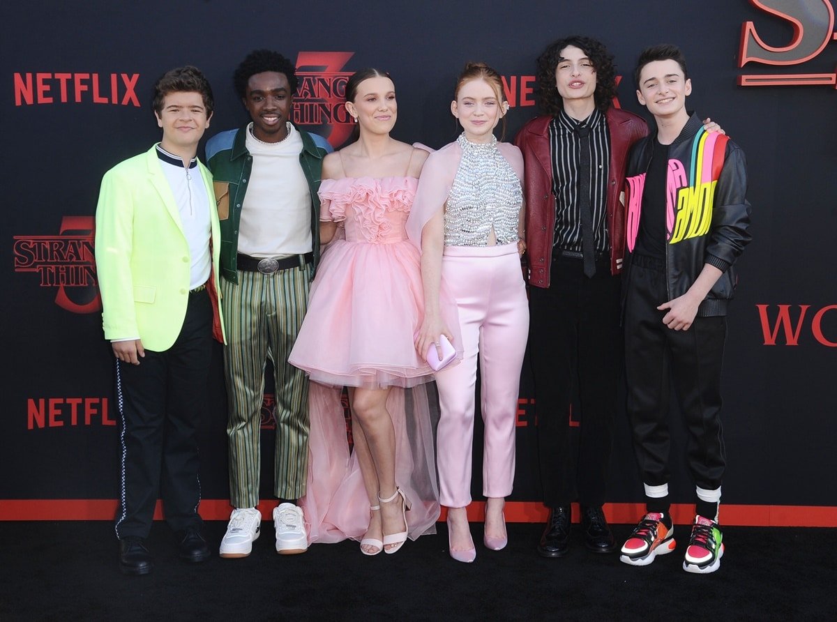 The cast of the science fiction horror drama television series Stranger Things: Gaten Matarazzo, Caleb McLaughlin, Millie Bobby Brown, Sadie Sink, Finn Wolfhard, and Noah Schnapp