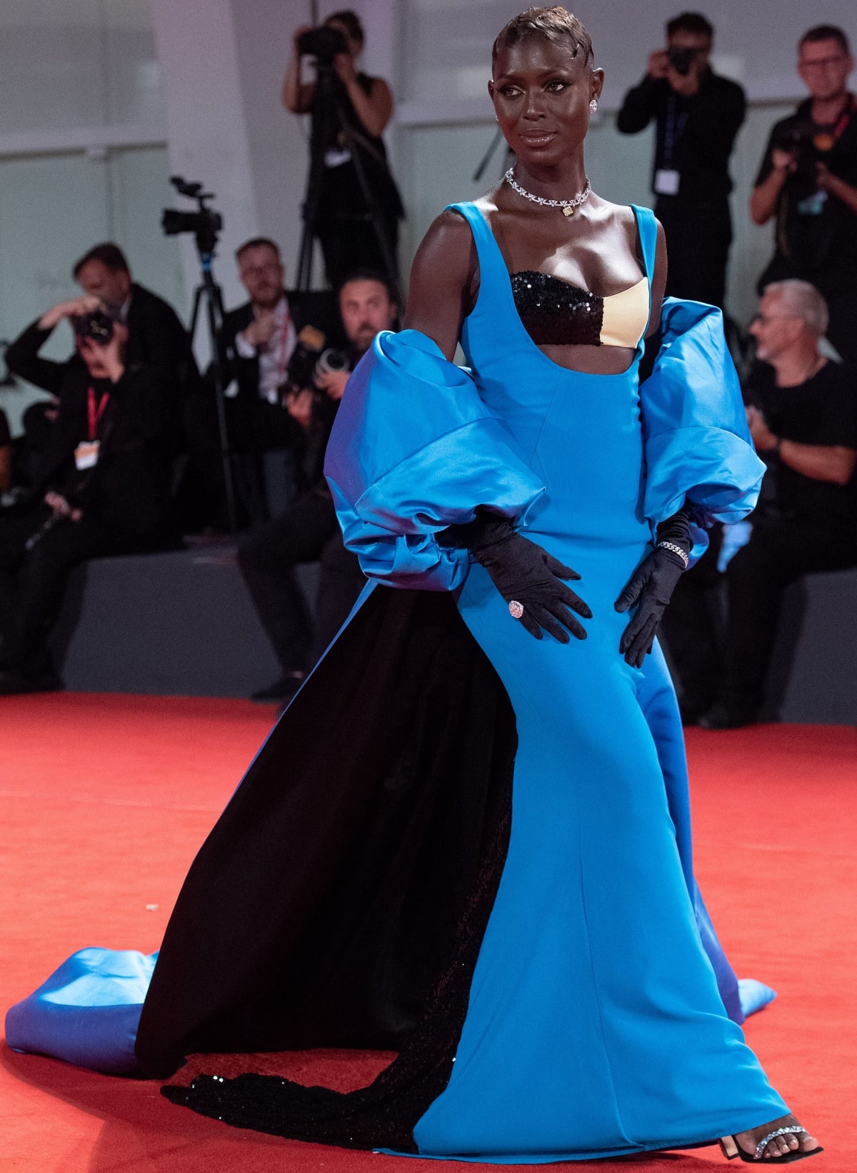 Jodie Turner-Smith enthralled in a Harbison Resort 2023 blue gown with matching cape and Giuseppe Zanotti heels