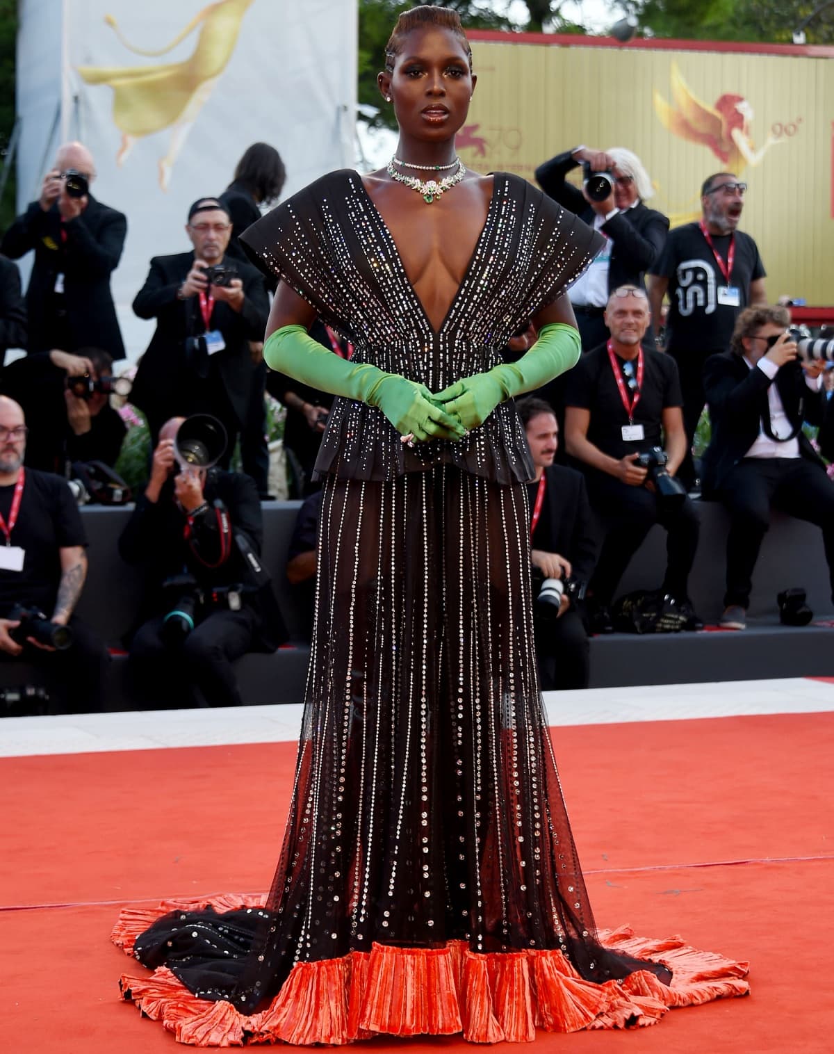 Jodie Turner-Smith looking regal in a custom Gucci gown with black leather thigh-high boots