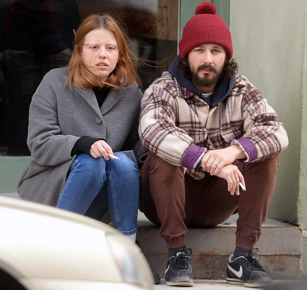 Mia Goth and Shia LaBeouf smoking outside in New York City