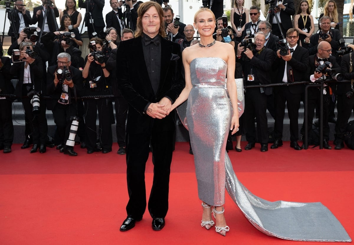 Norman Reedus and Diane Kruger in a custom AMI Alexandre Mattiussi silver strapless gown and MACH & MACH bow-detailed ankle-strap heels