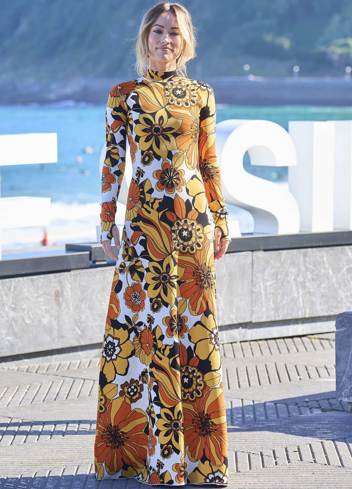 Olivia Wilde wearing a long-sleeved floral dress from Kwaidan Editions at the Don’t Worry Darling photocall