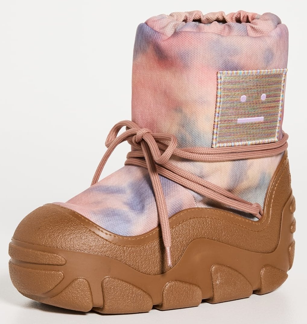 Peach orange snow boots from Acne Studios featuring an all-over cloud-inspired print with a contrast platform sole