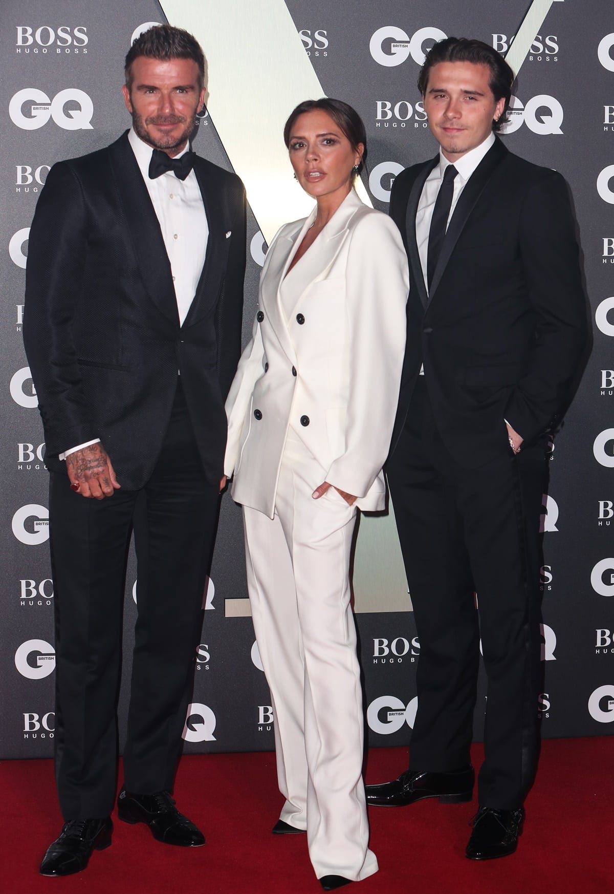David Beckham, Victoria Beckham, and their son Brooklyn Beckham attend the GQ Men Of The Year Awards 2019