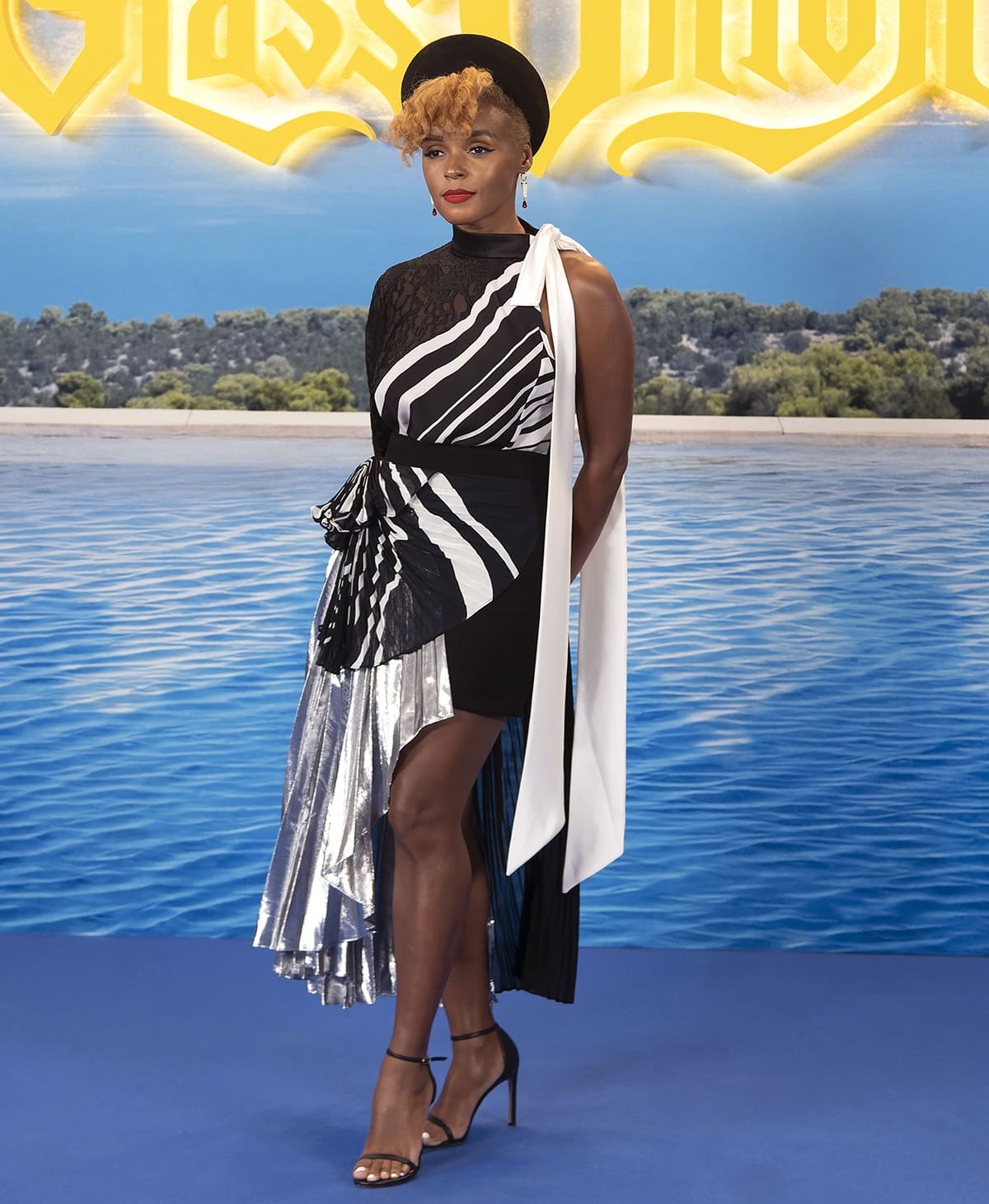Janelle Monae attends the Glass Onion photocall in a multilayered black and white Alfredo Martinez dress