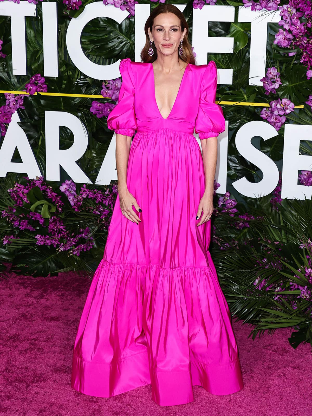 Julia Roberts hops on the Barbiecore bandwagon in a Greta Constantine Spring 2021 pink dress with puff sleeves and a plunging neckline